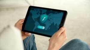 Person holding tablet with VPN connection screen for secure internet browsing.